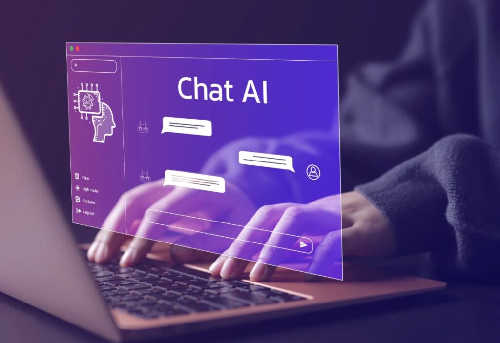 Mani su un portatile con un'interfaccia di chat con intelligenza artificiale: consulenza per l'adozione dell'AI